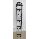 A cast-iron garden boot rack