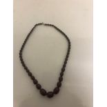 A cherry amber necklace,