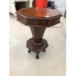 A 19th century walnut sewing table