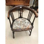 An Edwardian mahogany corner chair