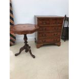 A reproduction two over three chest and inlaid wide table