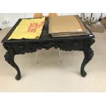 A carved hardwood Chinese desk with drawers,