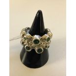 A silver abstract diopside ring