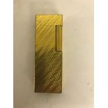 A gold-plated slim Dunhill lighter