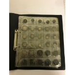 A black folder of coins 200 coins and tokens,