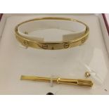 A cased Cartier 18k screw on love bracelet