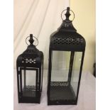 A pair of garden lanterns