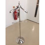 A chrome dress stand