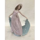 A Lladro figure of a damsel in hat CONDITION REPORT: In very good condition with no