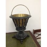 An Edwardian ebonised plant stand