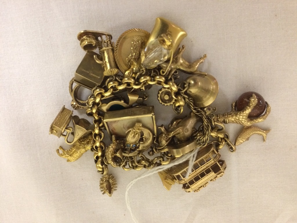 A large charm bracelet and charms