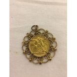 An 1889 gold sovereign in a 9ct gold mount