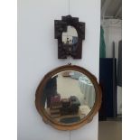 A vintage gilt-framed mirror;