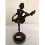 A bronze figure of a dancing lady