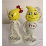 A pair of cast-metal Esso figures