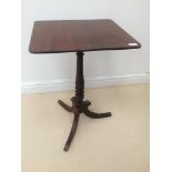 A 19th century mahogany tilt-top table