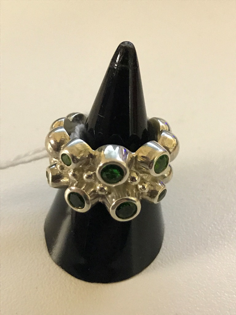 A silver abstract diopside ring