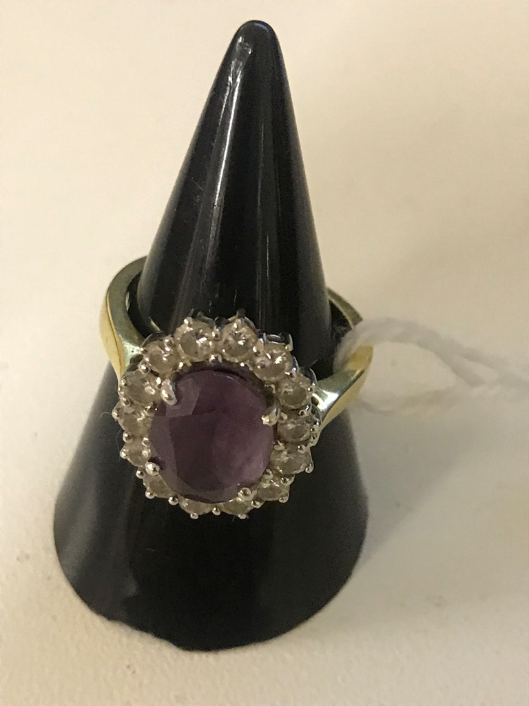 An 18ct diamond and amethyst dress ring