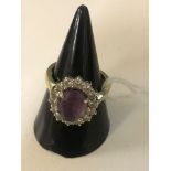 An 18ct diamond and amethyst dress ring