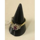 An 18ct ruby and diamond dress ring