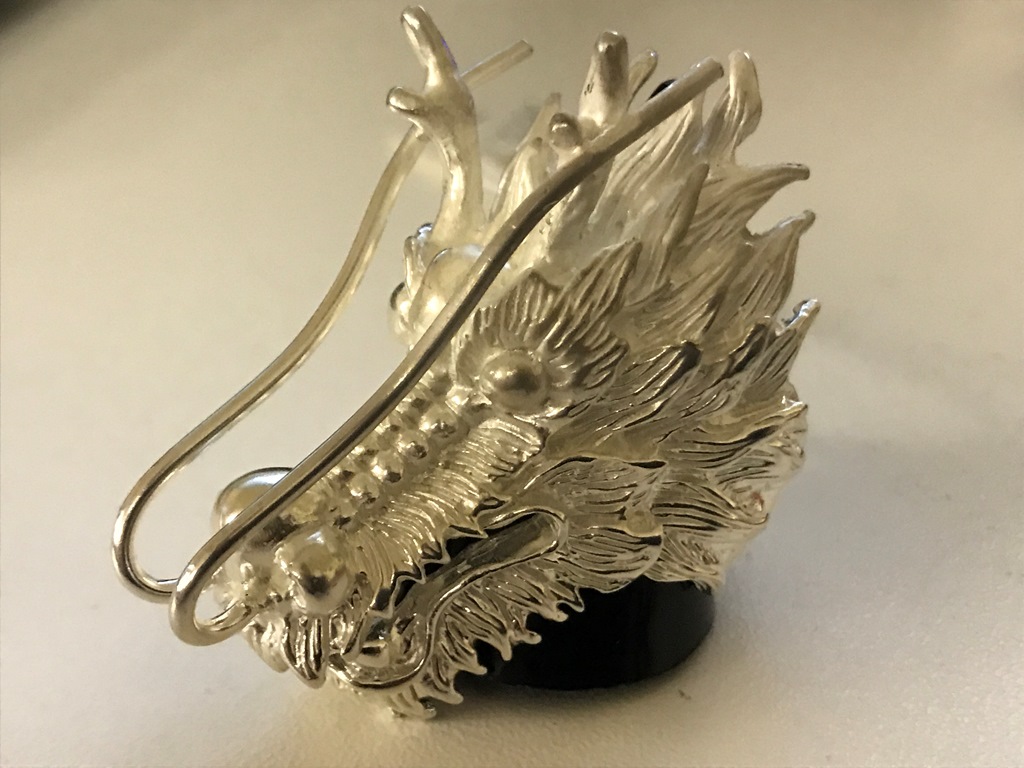 A silver dragonhead ring