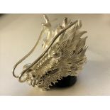 A silver dragonhead ring