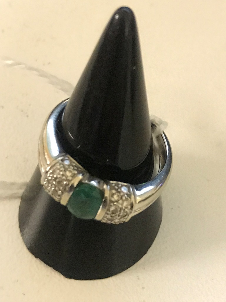 An 18ct emerald and diamond dress ring