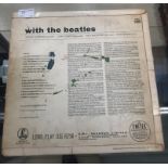 An album 'With The Beatles' with four signatures in pencil