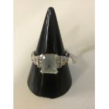 An 18ct Art Deco-style aquamarine/diamond ring