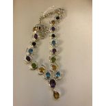 A silver multi-stone set abstract necklace