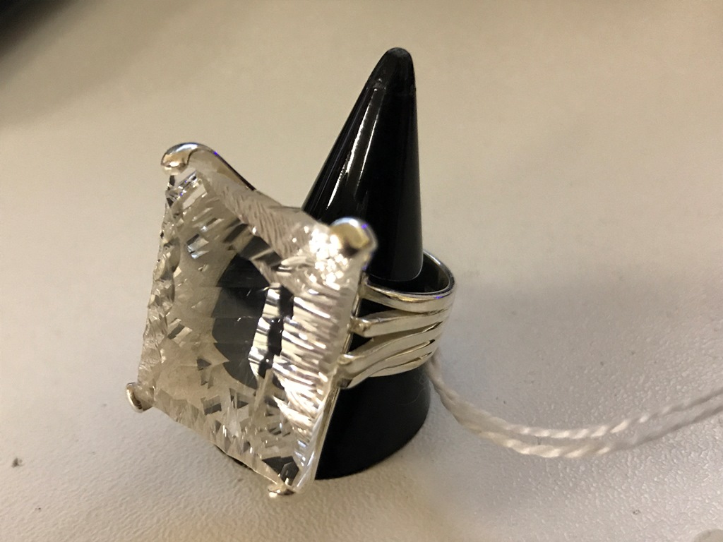 A silver and large rock crystal dress ring