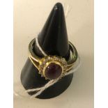 An 18ct cabochon ruby and diamond dress ring