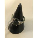 An 18ct olivine and diamond dress ring