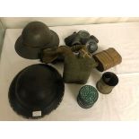 A WWII Brodie helmet; together with fire watchers, two gas masks,