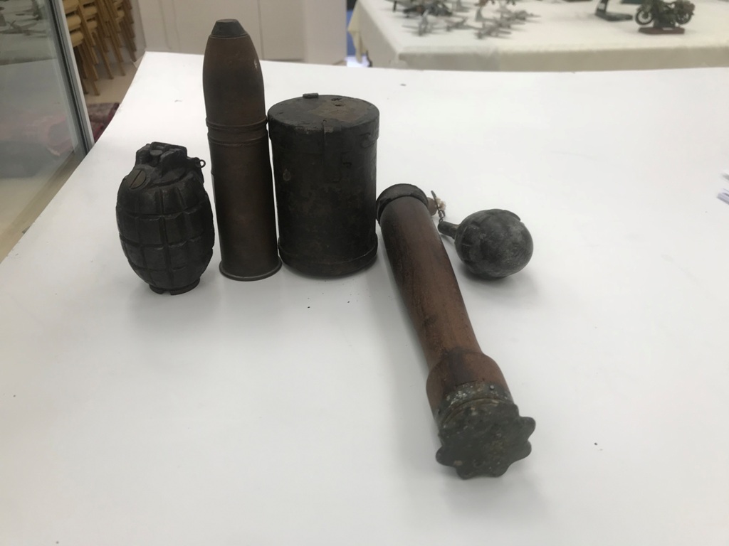WWI & WWII Egg grenade, Artillery shell, Mills bomb and German Stick grenade.
