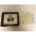 Cased WWI Iron Cross group of three medals with miniatures and paperwork.