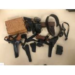 Box of leather Holsters and rigs.