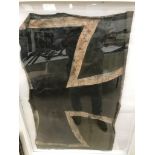 Framed and glazed WWI German Airplane crash relis of the canvas Sross from the side of the fuselage.