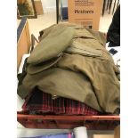 A quantity of WWII clothing to include 1944 Great Coat, Kilt, Scottish ,