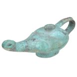 An Egyptian Oil Lamp: Bronze with green patination,