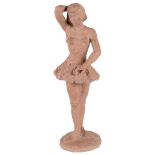 A Continental Terracotta Figure of a Standing Ballerina: In the manner of Degas,