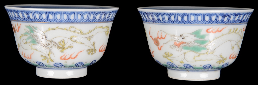 Two Chinese famille rose cups: 19th century, decorated with dragons chasing flaming pearls.