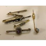 A quantity of gold bar brooches and stick pins to inc opal,