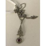 A Deco-style 18ct diamond and ruby pendant