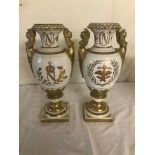 A pair of ceramic Napoleon urns (one A/F)