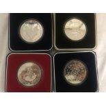 Four silver ounce coins to inc a Dollar