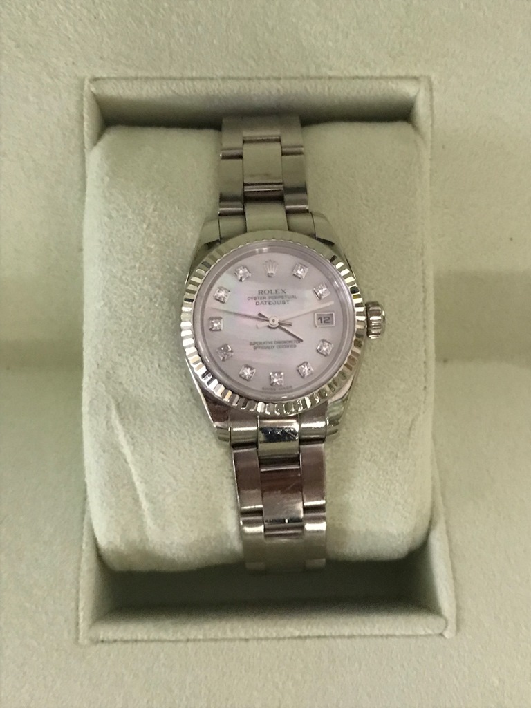 An 18ct ladies Rolex Oyster Datejust on an 18ct strap;