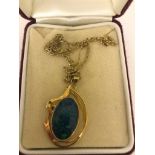 A 9ct black opal pendant on 9ct chain