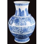 A Chinese blue and white vase: Decorated with two large bands of flower motifs above a a band of