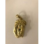 A 9ct pendant of Christ in profile